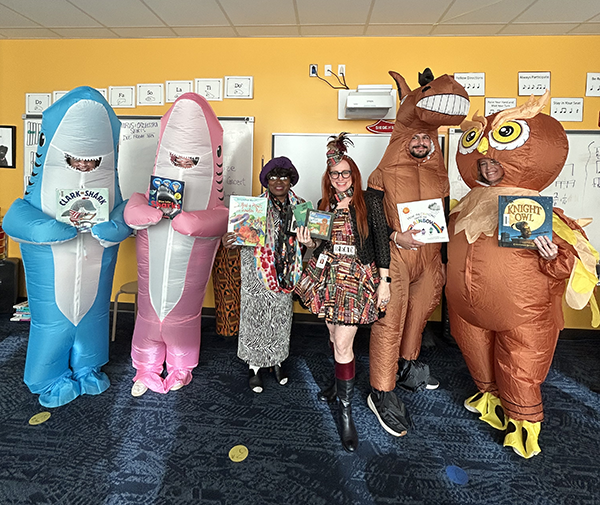 Midtown Academy had a “Masked Reader” event to promote their Scholastic Book Fair. The event was sponsored by the PTA organized and hosted by LMTS Meredith Myers, and featured Midtown staff in costumes reading their favorite books.